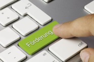 Tastatur mit Schriftzug "Förderung" auf der Entertaste